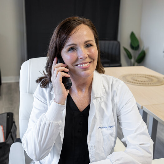 Photo of Nurse Practitioner Amanda Mendoza talking on the phone