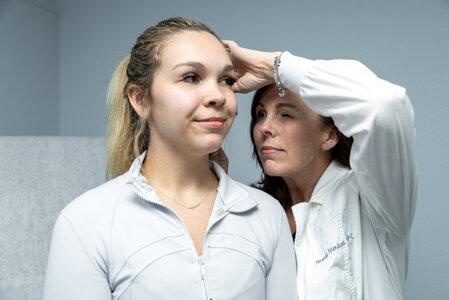 Photo of Nurse Practitioner Amanda Mendoza checking patient